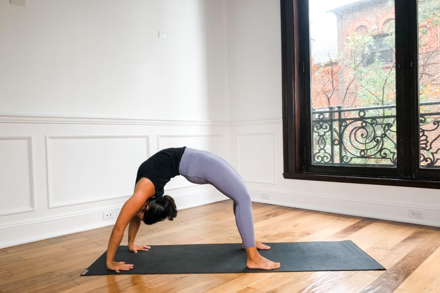 Girl in full wheel pose