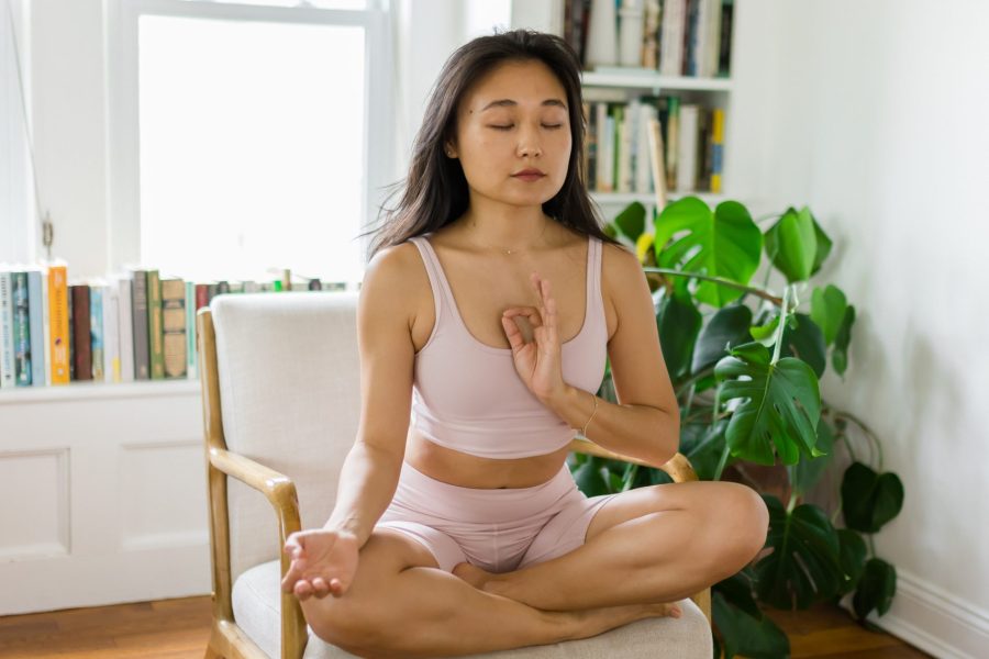 A serene yogi meditating in a peaceful natural setting, symbolizing the principle of Santosha and the cultivation of inner contentment and peace.