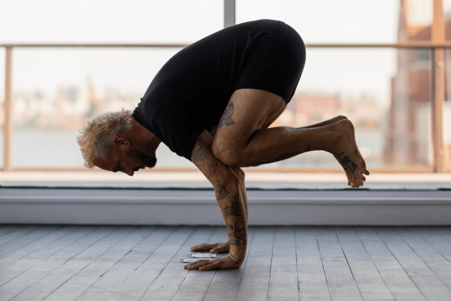 Patrick Franco in a popular arm balance known as crow pose or Bakasana